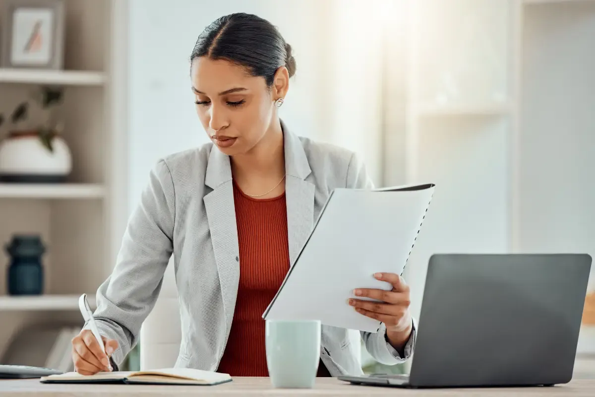 articles-of-incorporation-img.webp Business owner reviewing Articles of Incorporation filing requirements and corporate formation documents needed to incorporate a business and meet certificate of incorporation requirements in 2026.