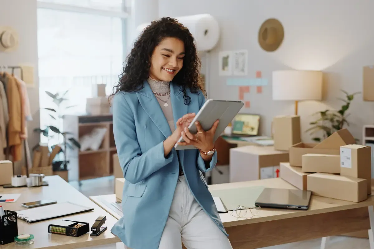 Small business owner managing intellectual property protection and licensing copyrighted work for business content protection using a tablet