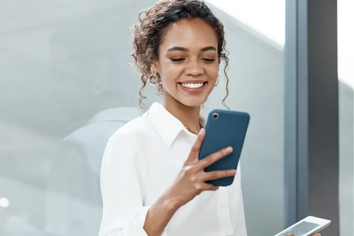 copyright-registration-img.webp LLC business owner filing copyright registration online to protect digital content and creative works for her company using a mobile device.
