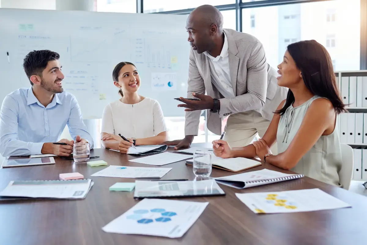 fictitious-business-name-img.webp Business team discussing how to register a fictitious business name and do I need a fictitious business name for my LLC considerations for branding purposes.