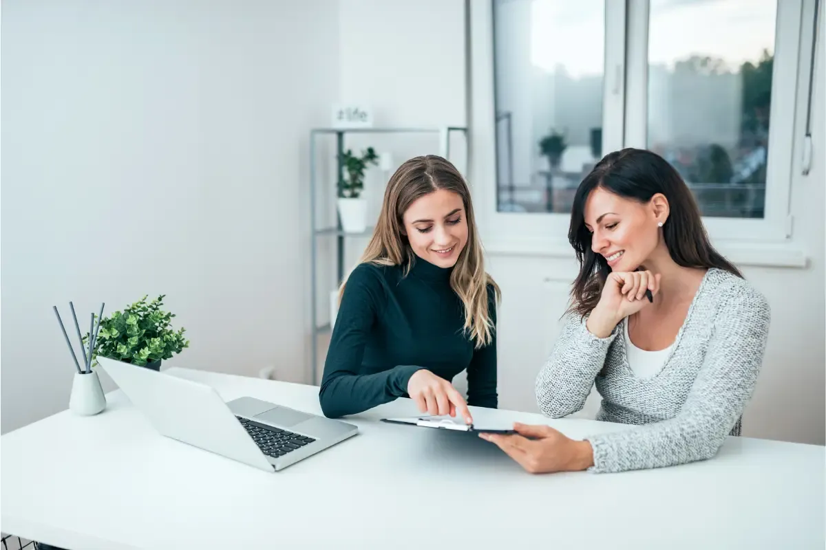 hiring-a-registered-agent-img.webp Business owners consulting about registered agent costs and hiring professional registered agent services for business compliance and legal document handling.