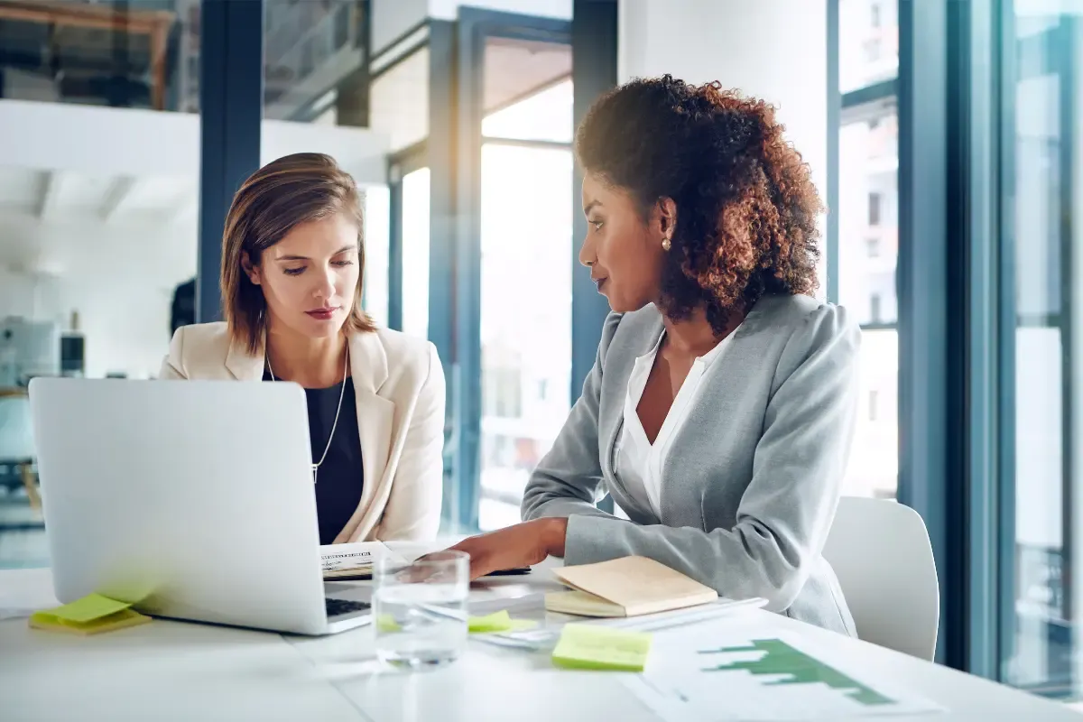 Business owners comparing registered agent services and reviewing state requirements for compliance and eligibility