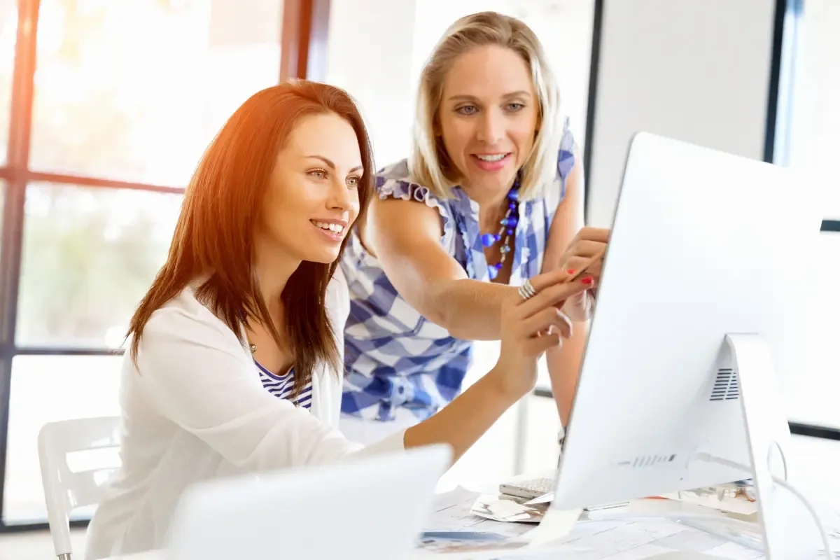 how-to-choose-the-right-registered-agent-img.webp Business professionals consulting about how to choose the right registered agent for business formation and legal compliance requirements.