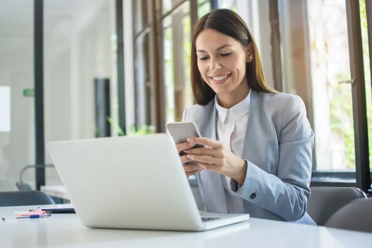 Business professional comparing InCorp vs LegalZoom registered agent services and LLC formation pricing on laptop in modern office.
