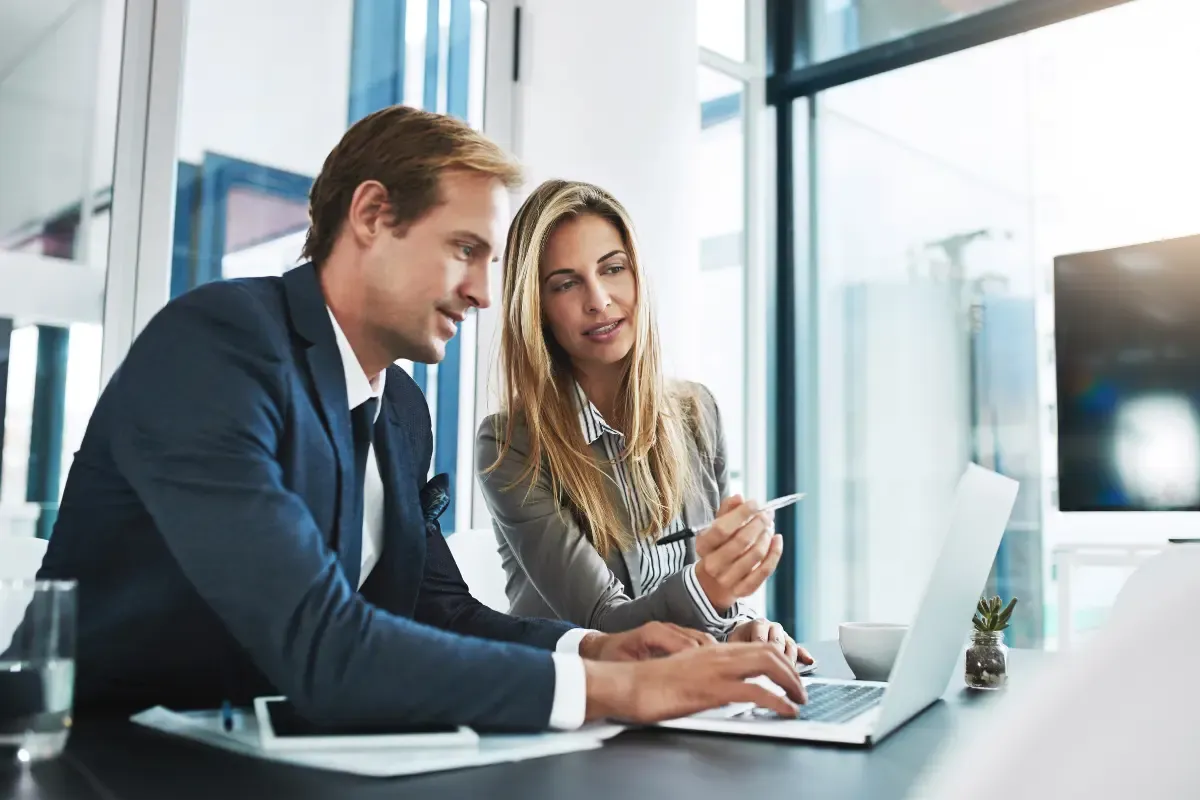 Business professionals reviewing registered agent address options and commercial registered agent services for LLC legal compliance.