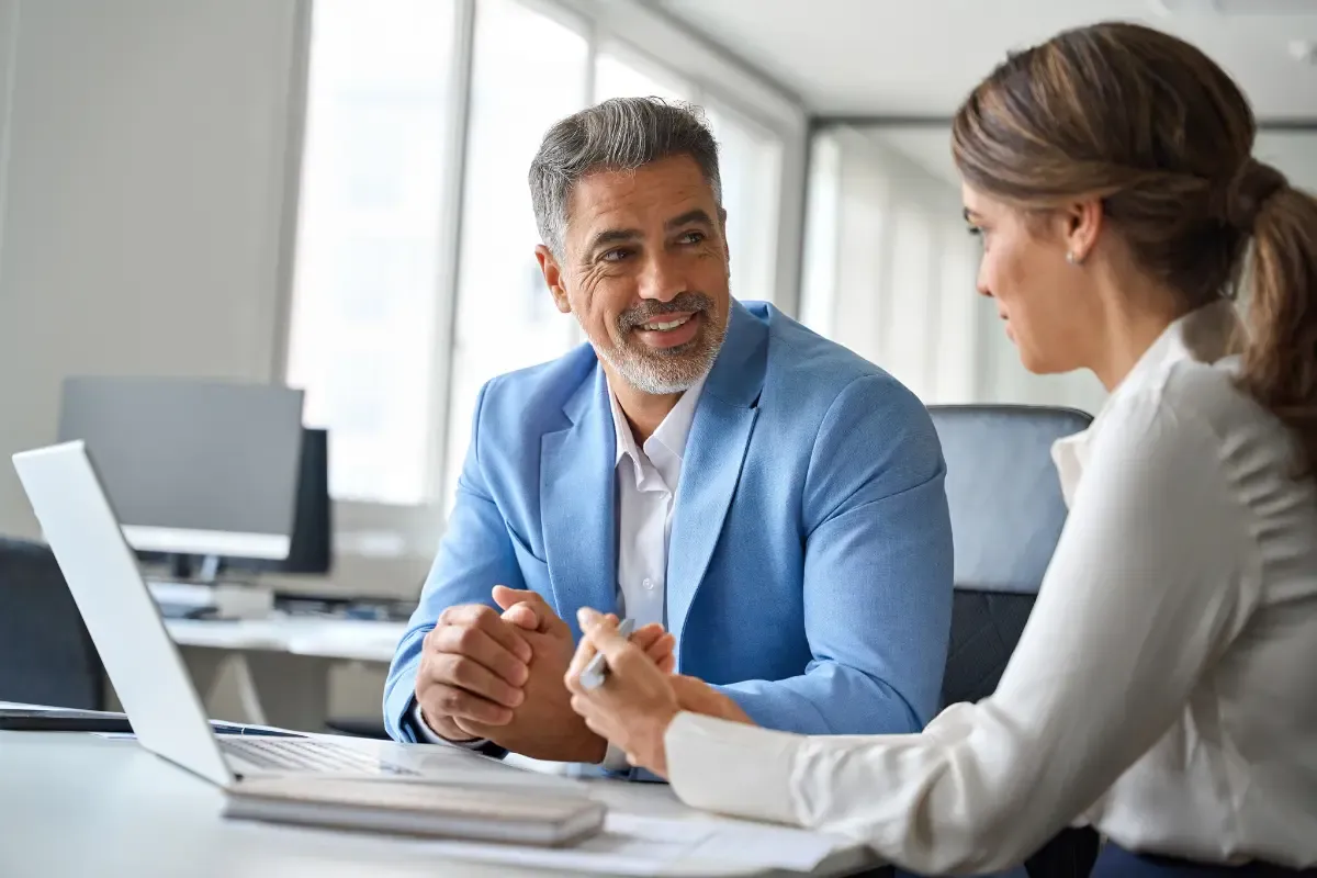 registered-agent-vs-incorporation-service-img.webp Business professionals consulting on registered agent and incorporation services for company formation and legal compliance requirements