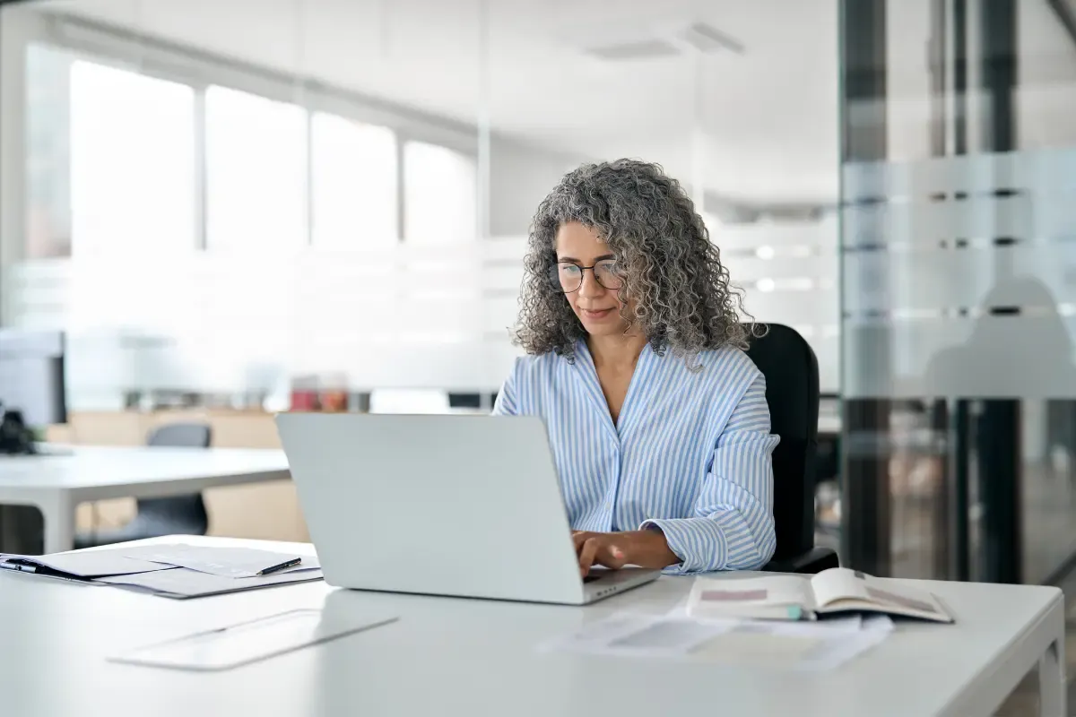 Business owner researching types of business entities and business structure options online to choose the right entity management type before forming a company